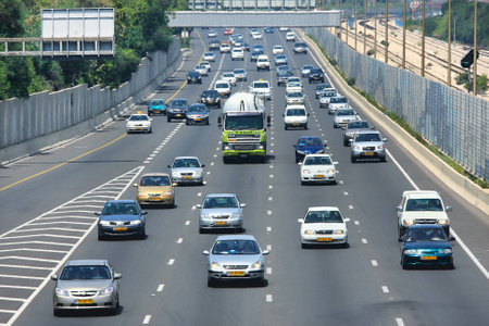 TEL AVIV - MAY 07: Traffic flow on Ayalon highway during rush hour at sunny hot day. Highway 20 aka Ayalon Highway is multi-lane highway and major intracity freeway in Tel Aviv, Israel on May 07, 2010.のeditorial素材