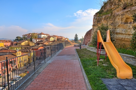 Yellow children slide on public playground in small town of Diano Dの写真素材