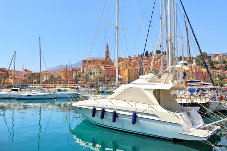 Yachts and boats on marina and colorful houses of Menton on the background on French Riviera  Cote dの写真素材