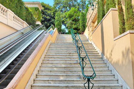 Staircase with marble stairs and escalator in Monte Carlo, Monaco  view from the bottom  の写真素材