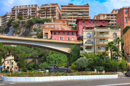 MONTE CARLO - JULY 13  Colorful buildings and sculpture of William Grover-Williams in Bugatti racing car- the first winner of Monaco Grand Prix on April 14, 1929 in the center of Monte Carlo, Monaco on July 13, 2013 のeditorial素材