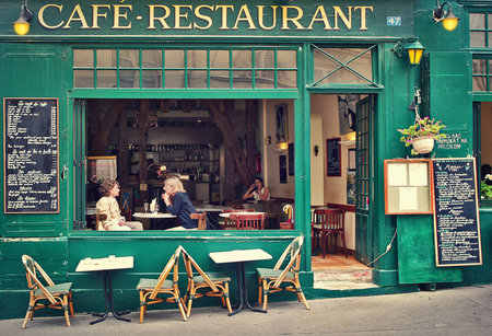 PARIS - JULY 08  Two women sitting on open terrace in typical Parisian cafe  Restaurants, bars and coffee shops on sidewalks are very popular with parisians and tourists visiting Paris, France on July 08, 2007 のeditorial素材