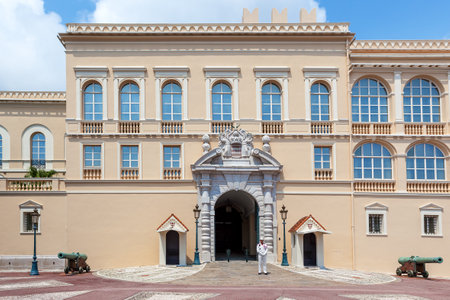 MONACO-VILLE, MONACO - JULY 13, 2013  Facade of official residence of Prince of Monaco and security guard at the entrance   Palace Guards group created in 1817, provide security for Palace, residence, Prince and his family のeditorial素材