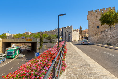 JERUSALEM, ISRAEL - JULY 10, 2014: Pedestrian walkway and urban road near Jaffa Gate - one of eight gates in the historic walls of the Old City of Jerusalem  built in 1583 by Suleiman the Magnificent.のeditorial素材