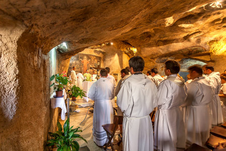 JERUSALEM, ISRAEL - JULY 13, 2014: Franciscan monks pray in Grotto of Gethsemane - chapel located in...