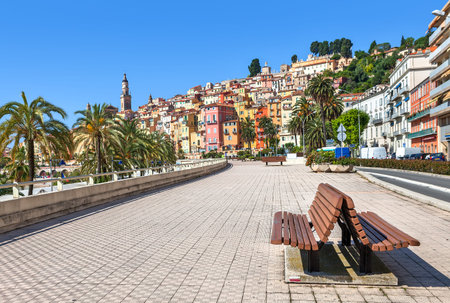 Promenade along streets and colorful houses of Menton - town and touristic resort on French Riviera.のeditorial素材