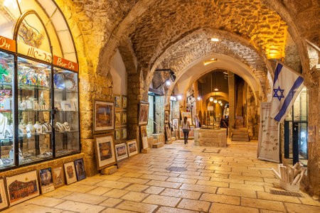 JERUSALEM, ISRAEL - JULY16, 2015: Gift shops  gallery in ancient stone vault passage in Old City of Jerusalem - one of the oldest cities in the world and holy in Judaism, Islam and Christianity.のeditorial素材