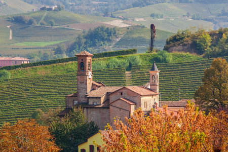 Old medieval church in small town of Barolo in Piedmont, Northern Italy.の写真素材