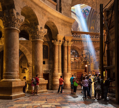 JERUSALEM, ISRAEL - JULY 26, 2015: People inside the Church of the Holy Sepulchre - holy place where according christian tradition Jesus was crucified, buried and resurrected.のeditorial素材