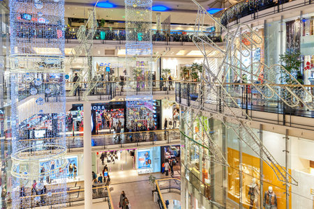PRAGUE, CZECH REPUBLIC - DECEMBER 10, 2015: Interior view of Palladium mall decorated for Christmas holidays - one of the biggest shopping centers in Prague, popular destination with locals and tourists, contains 5 floors, 184 shops and 23 restaurants.のeditorial素材