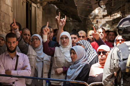 JERUSALEM, ISRAEL - JULY 26, 2015: Palestinians protest in Old City of Jerusalem against ascent of religious jews to Temple Mount during Tisha B'Av - annual fast day in Judaism commemorates destruction of  First and Second Temples.のeditorial素材
