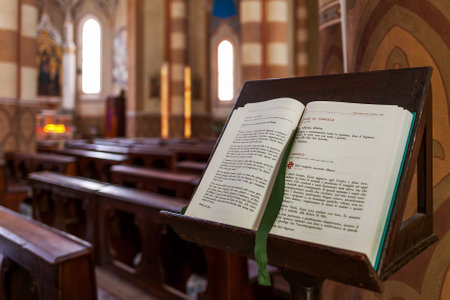 ALBA, ITALY - MAY 11, 2015: Open Bible on the stand inside San Lorenzo Cathedral (aka Duomo) - biggest and one of the important cathedrals in town of Alba dedicated to Saint Lawrence.のeditorial素材