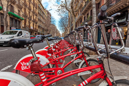 BARCELONA, SPAIN - JANUARY 13, 2015: Bicing bicycles sharing station on the street of Barcelona. This service inaugurated in 2007, covers small and medium daily routes within the city, consists of more than 420 stations.のeditorial素材