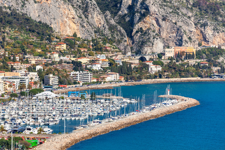 View of marina with yachts along shoreline of Menton - small town on French Riviera.の写真素材