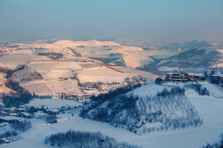 Hills and vineyards of Langhe covered with snow in Piedmont, Northern Italy.の写真素材