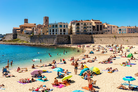 ANTIBES, FRANCE - SEPTEMBER 01, 2017: People on Plage de la Gravette - famous and popular sand beach near the Old Town of Antibes, France.のeditorial素材