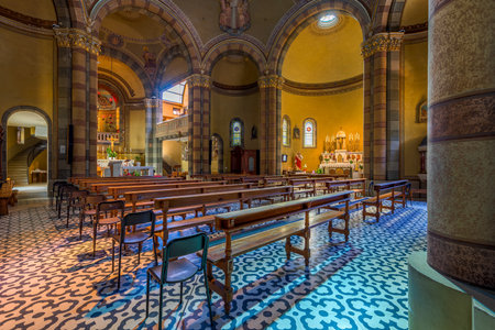 ALBA, ITALY - JUNE 23, 2020: Interior view of the nave, wooden pews and altar in Madonna della Moretta church in Alba - small town in Piedmont, famous for truffles and wine production.のeditorial素材
