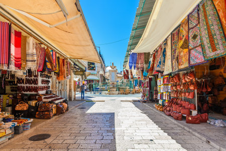 JERUSALEM, ISRAEL - JULY 10, 2014: Bazaar in Old City of Jerusalem offers middle east traditional products and souvenirs. It is very popular with locals, tourists and pilgrims visiting Israel.のeditorial素材
