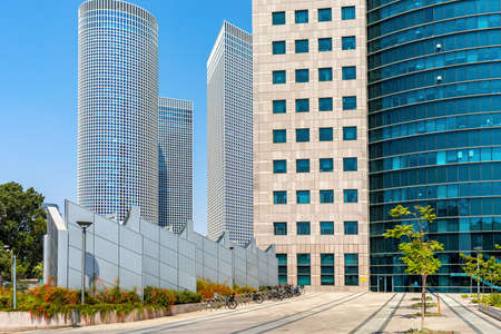 Modern buildings and Azrieli center on background under blue sky in Tel Aviv, Israel.の写真素材