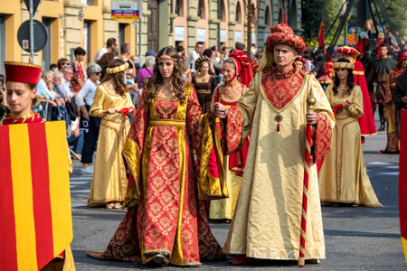 ALBA, ITALY - OCTOBER 01, 2017: People wearing historic dresses on Medieval Parade - traditional part of celebrations during annual White Truffle festival taking place each year in Alba, Italy.のeditorial素材