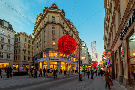 VIENNA, AUSTRIA - DECEMBER 03, 2019: People walking on pedestrian street decorated and illuminated for Christmas holidays in the center of Vienna - capital and largest city of Austria.のeditorial素材