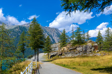 View of the footpass along the mountains and Ceresole lake in Piedmont, Italy.の写真素材