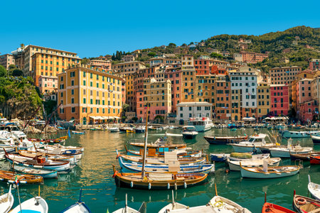 View of the boats in the harbor and colorful houses in small town of Camogli, Liguria, Italy.の写真素材