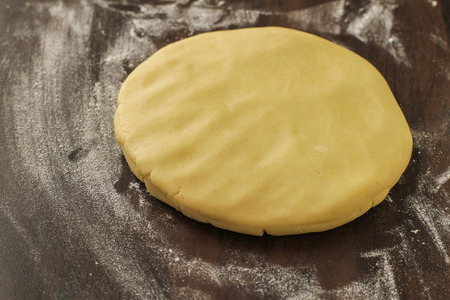 Laying down doung on the floured tableの写真素材
