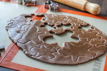 Cutting man shape figurines with a metal cutterの写真素材