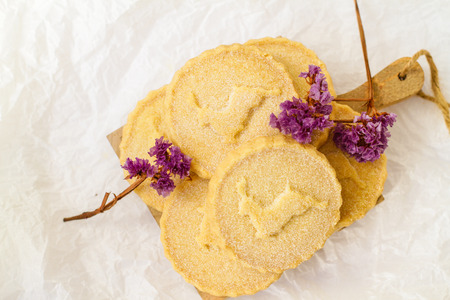 Shortbread biscuits on the white surface with lavender flowersの写真素材