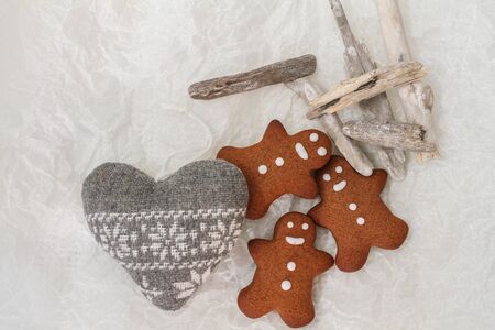 Three Gingerbread man cookies on tha tableの写真素材