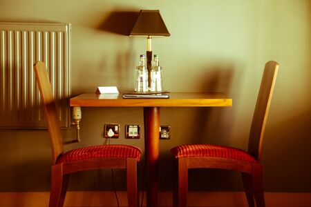 Two chairs and table in the hotel roomの写真素材