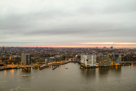 Dusk view over the river on to City of Amsterdam, Netherlandsの写真素材