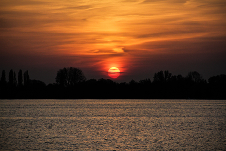 Beatiful sunset over the River in the Netherlandsの写真素材