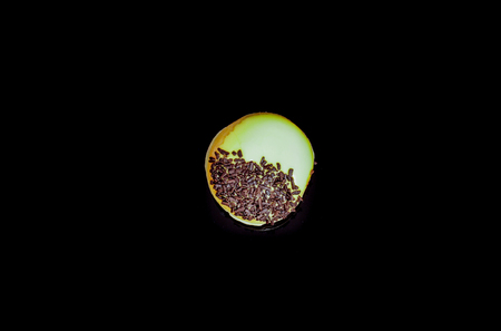 Tasty and deliciously looking donuts on black backgroundの写真素材