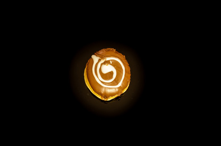 Tasty and deliciously looking donuts on black backgroundの写真素材