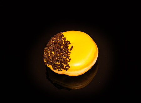Tasty and deliciously looking donuts on black backgroundの写真素材