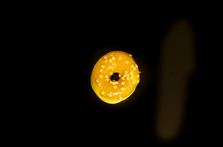 Tasty and deliciously looking donuts on black backgroundの写真素材