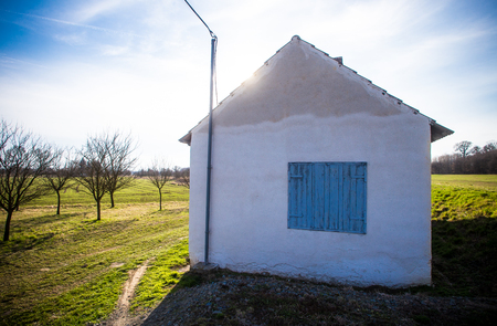Cottage with blue shutterの写真素材