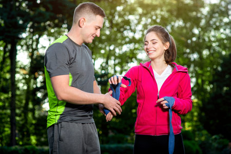 Sports couple in sportwear having fun in the parkの写真素材