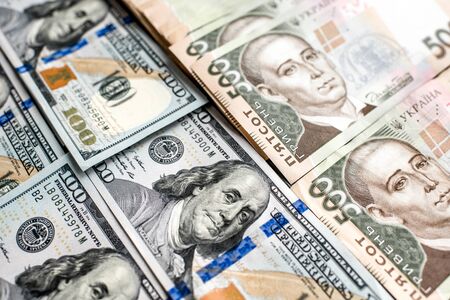 Pile of Ukrainian and American money banknotsの写真素材