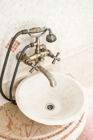 Classic round sink in the bathroom with mosaicの写真素材