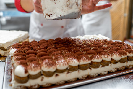 Making tiramisu cookies with savoiardi and mascarpone in the restaurant kitchenの写真素材