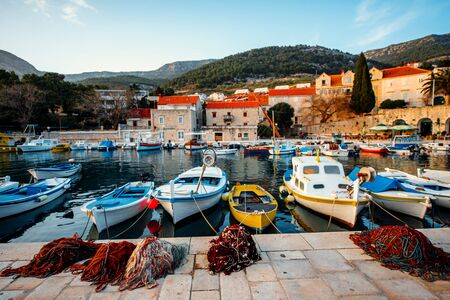 Boats with fishing tools at marine in old city, Croatiaの写真素材