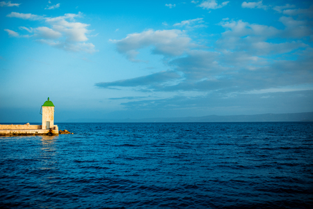 Square lighthouse in Bol city on Brac island on the sunset.の写真素材