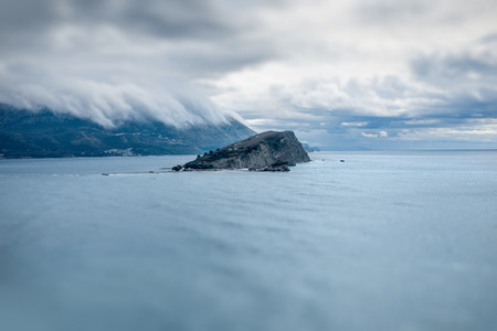 St. Nicholas island at cloudy and stormy weather in Montenegroの写真素材