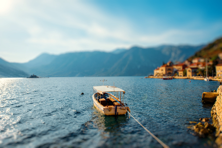 Lonely boat floating in Kotor bay near Peast city, Montenegroの写真素材