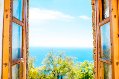 Old wooden window with view on seascapeの写真素材