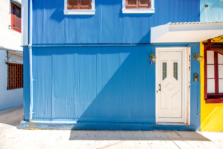 Old blue painted facade with white door in Greeceの写真素材