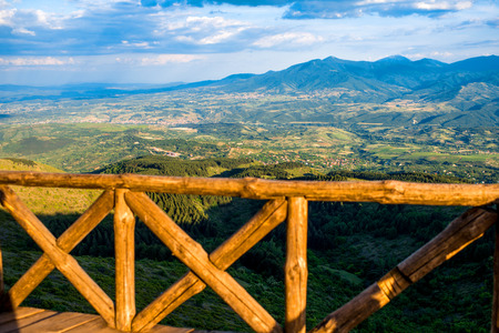 Beautiful mountain landscape view from the terrace with wooden fence in Macedoniaの写真素材